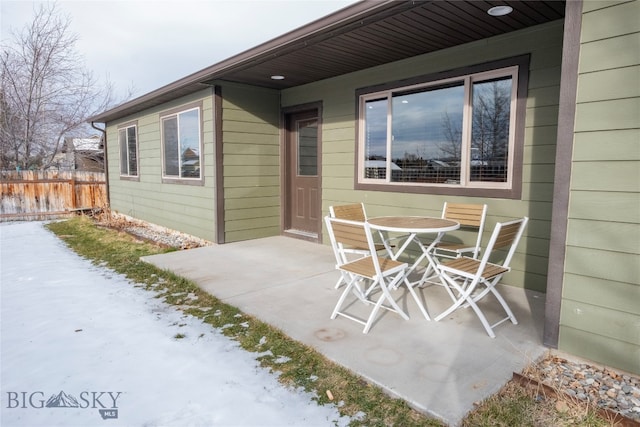 view of snow covered patio