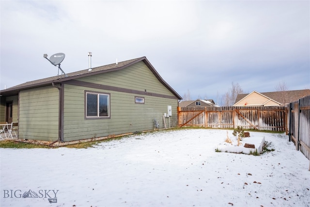 view of snow covered house