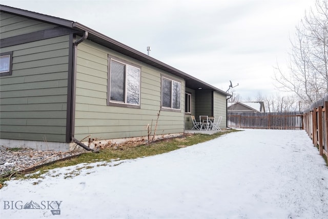 view of snow covered property