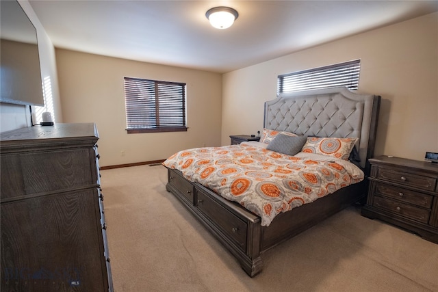 bedroom featuring light colored carpet