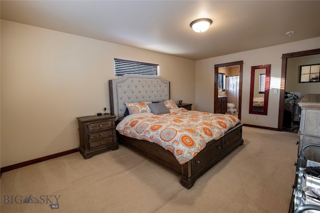 bedroom with light carpet, ensuite bath, and multiple windows