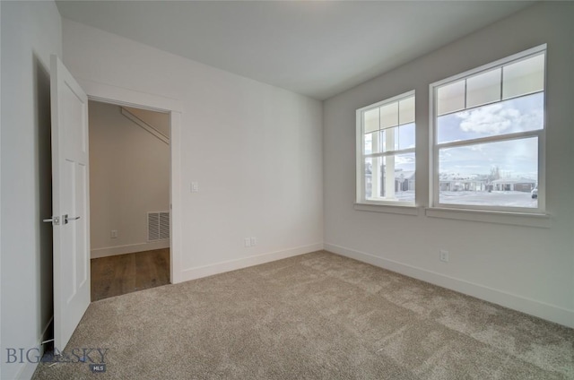 unfurnished bedroom featuring light colored carpet