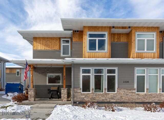 view of snow covered house