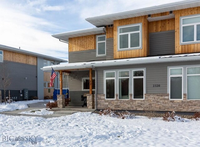 view of snow covered property