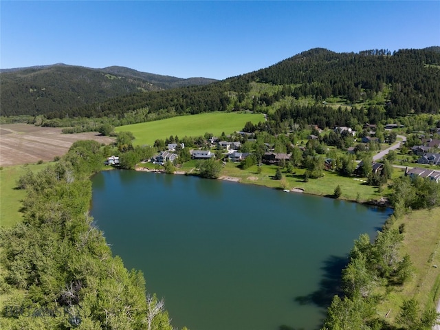 bird's eye view featuring a water and mountain view