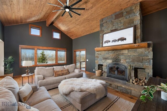 living room with a fireplace, ceiling fan, plenty of natural light, and wood ceiling