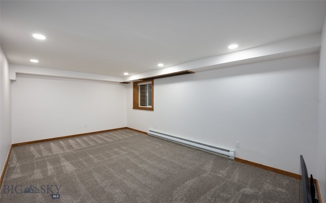 basement with carpet flooring and baseboard heating