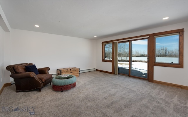 unfurnished room with light carpet and a baseboard radiator