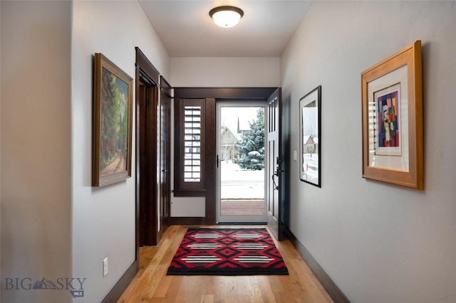 doorway with light hardwood / wood-style flooring