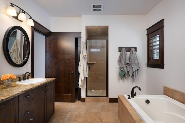 4543 Danube Ln, Bozeman, MT 59718 - bathroom with a shower stall, vanity, visible vents, and a bath
