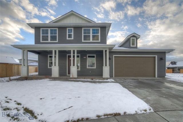 view of front of property with covered porch and a garage