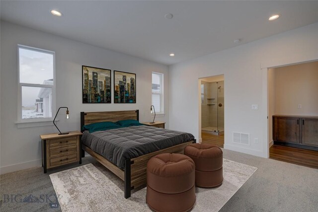 bedroom featuring carpet flooring and ensuite bathroom