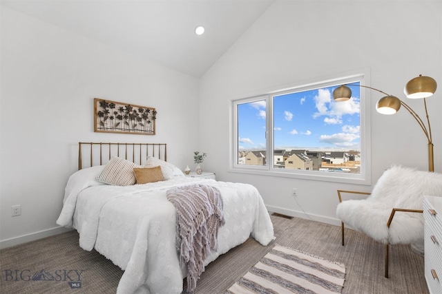 carpeted bedroom featuring high vaulted ceiling