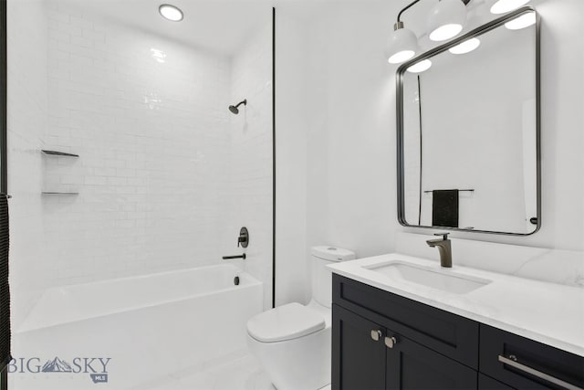 full bathroom featuring vanity, tiled shower / bath combo, and toilet