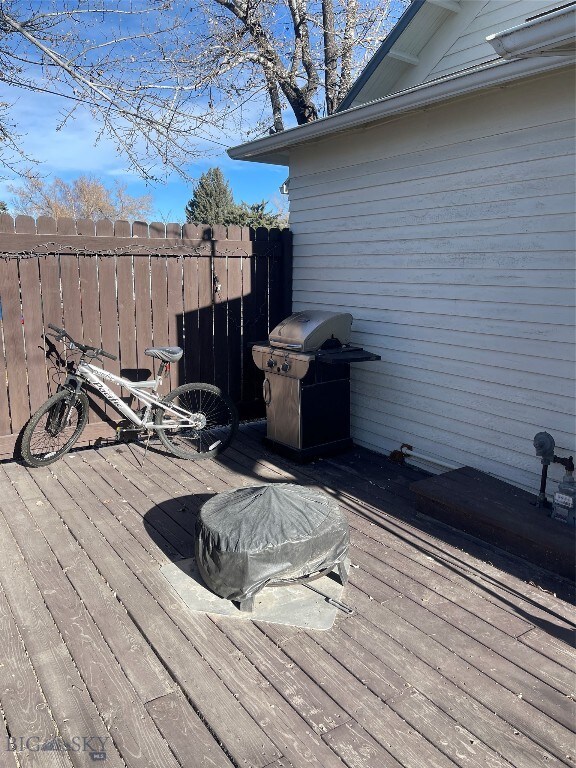 wooden deck featuring grilling area