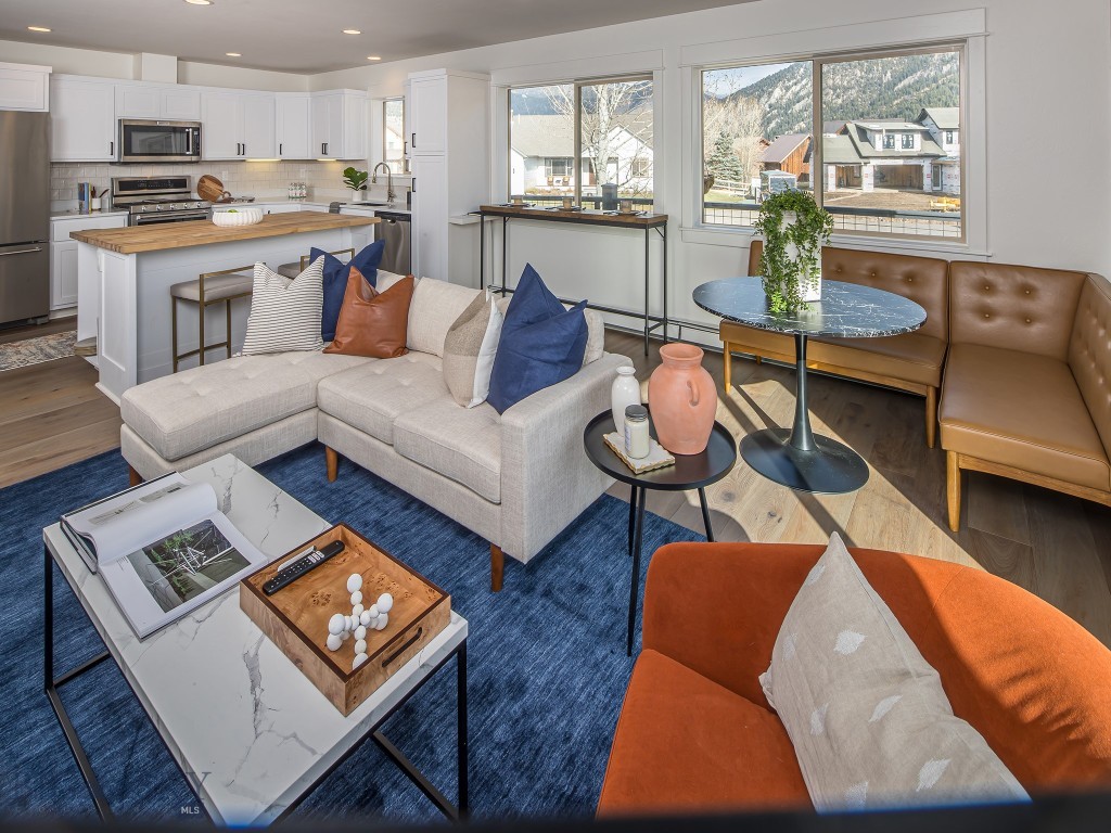 living room featuring dark hardwood / wood-style floors, plenty of natural light, and sink