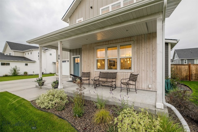 rear view of house featuring a porch