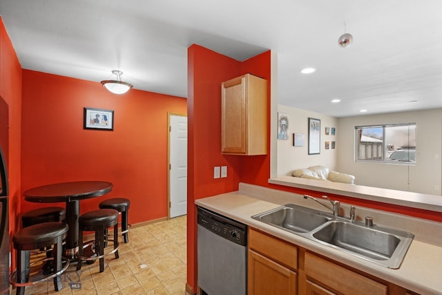 kitchen with stainless steel dishwasher and sink