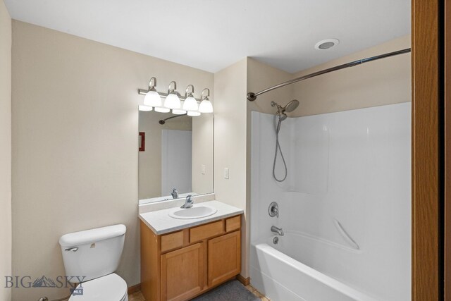 full bathroom with bathtub / shower combination, vanity, and toilet