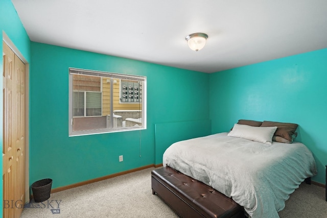 carpeted bedroom with a closet