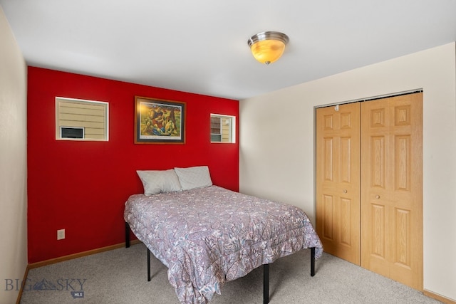 carpeted bedroom featuring a closet