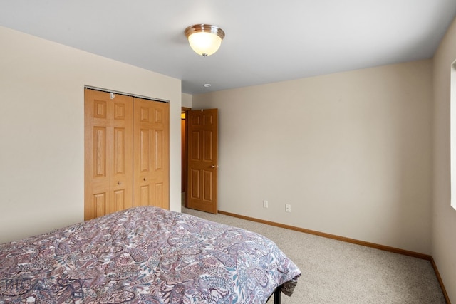 bedroom with a closet and carpet