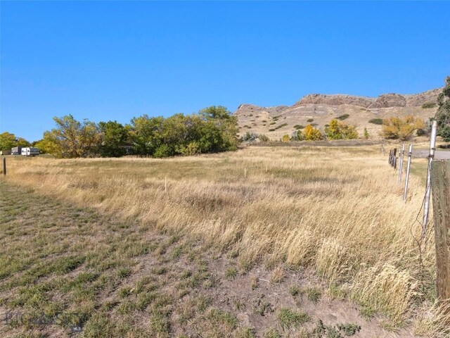 mountain view featuring a rural view