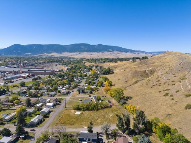 birds eye view of property featuring a mountain view