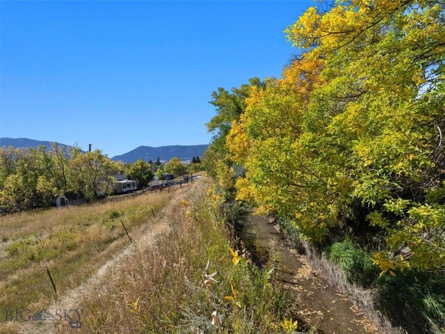 view of mountain feature with a rural view