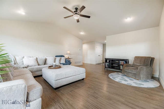 living room featuring dark wood-type flooring, ceiling fan, and lofted ceiling