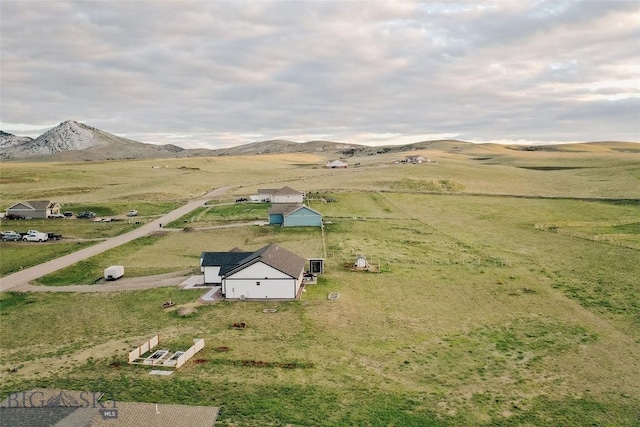 drone / aerial view featuring a mountain view and a rural view