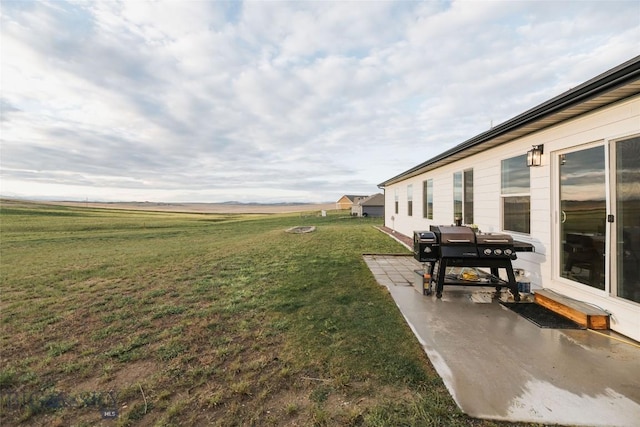 view of yard featuring a patio and a rural view