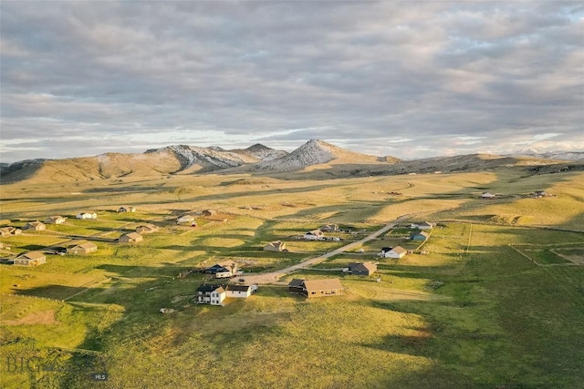 birds eye view of property featuring a mountain view and a rural view