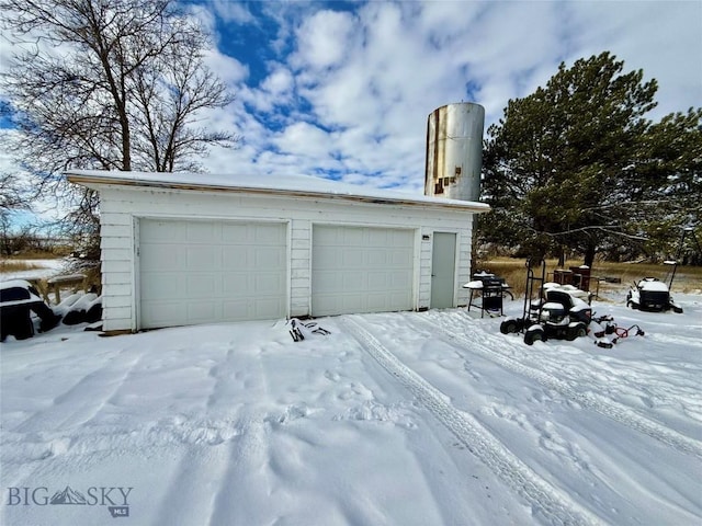 view of snow covered garage