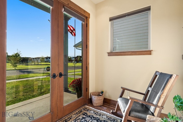 doorway to outside with french doors and hardwood / wood-style flooring