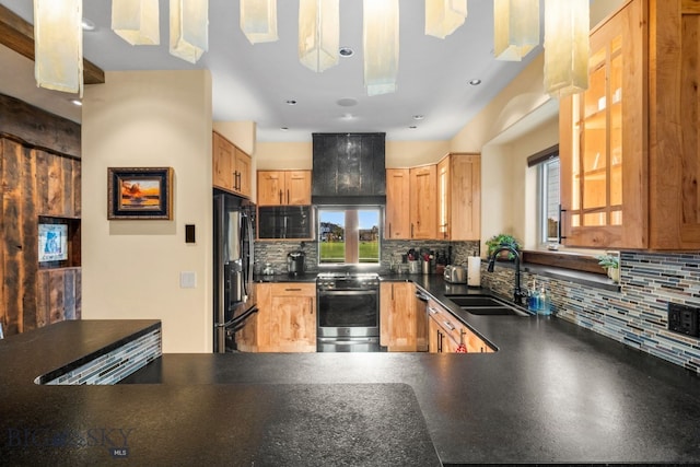 kitchen with plenty of natural light, sink, black fridge with ice dispenser, and stainless steel range with electric stovetop