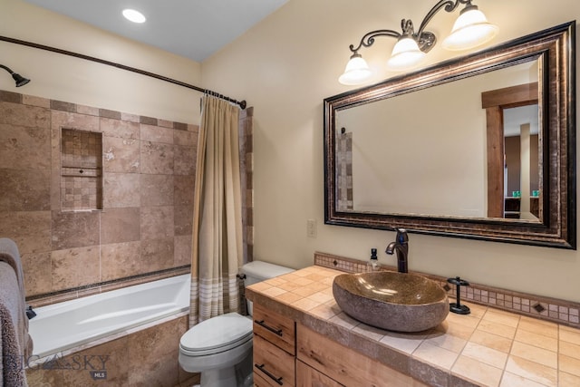 full bathroom with shower / bath combo, vanity, and toilet