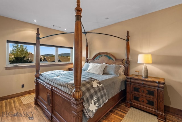 bedroom with hardwood / wood-style floors