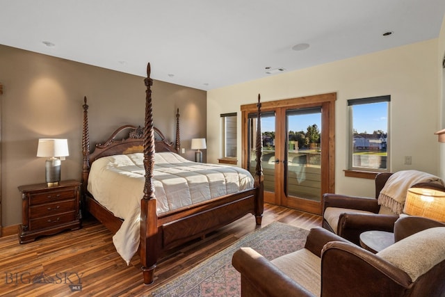 bedroom featuring dark wood-type flooring, access to outside, and french doors