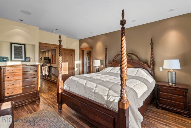 bedroom featuring dark hardwood / wood-style flooring