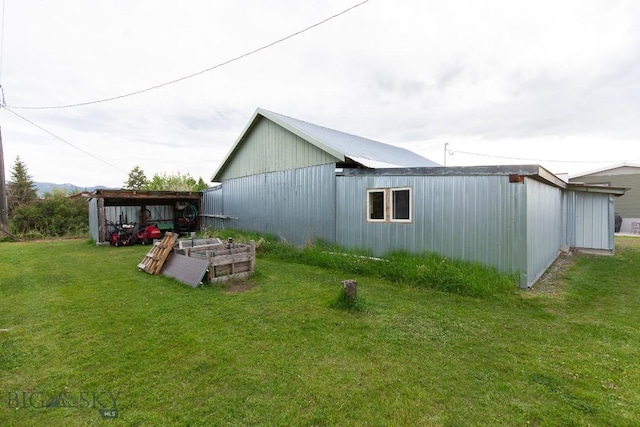 view of side of property with a yard