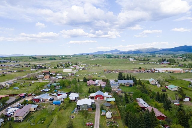 birds eye view of property featuring a mountain view