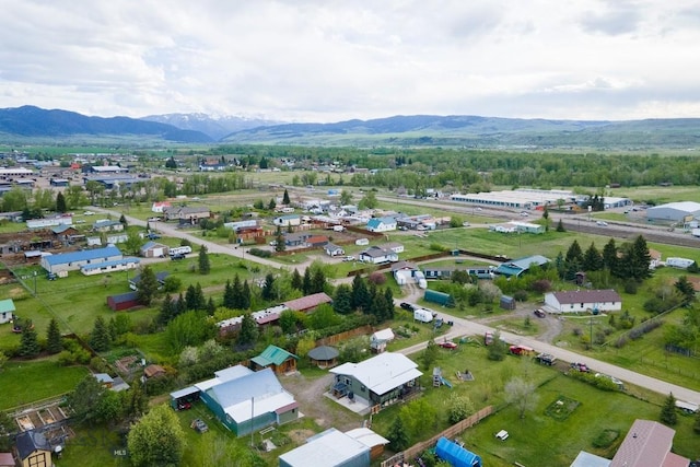 birds eye view of property with a mountain view