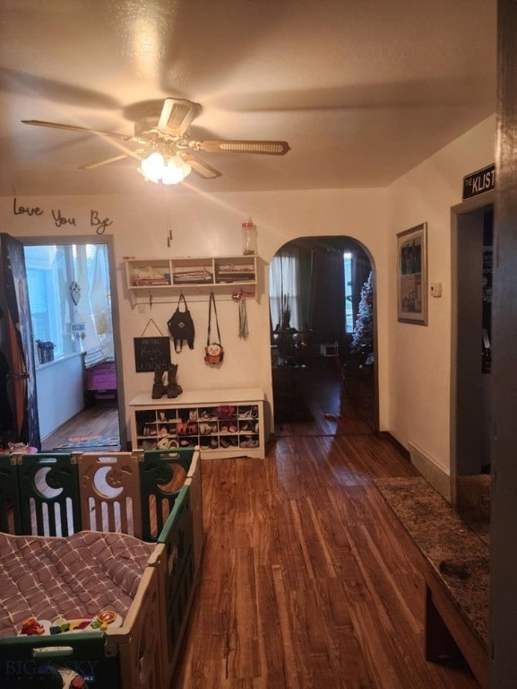 corridor with dark hardwood / wood-style floors