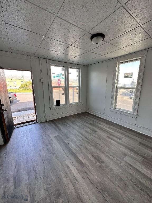 interior space with hardwood / wood-style floors and a paneled ceiling