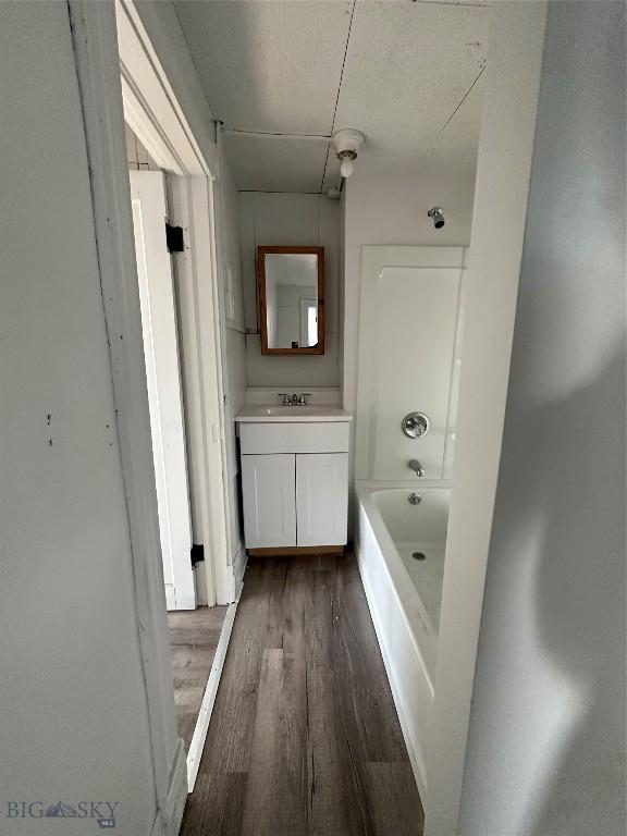 bathroom with vanity and hardwood / wood-style flooring