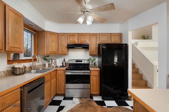 kitchen featuring a textured ceiling, crown molding, sink, and appliances with stainless steel finishes