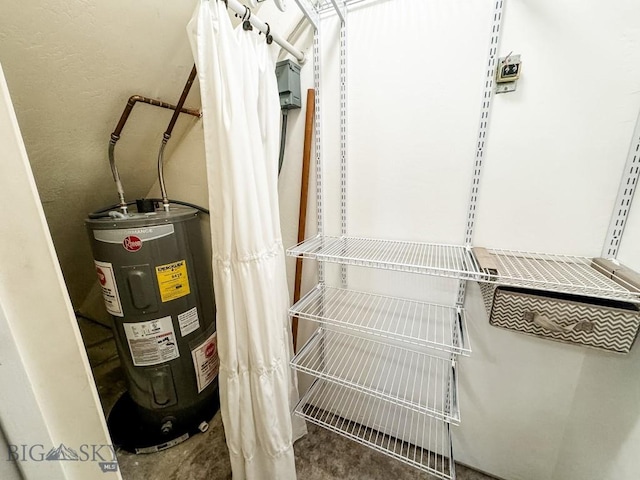 utility room featuring electric water heater