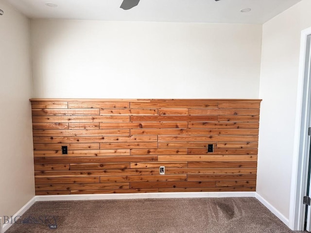 spare room featuring carpet and ceiling fan