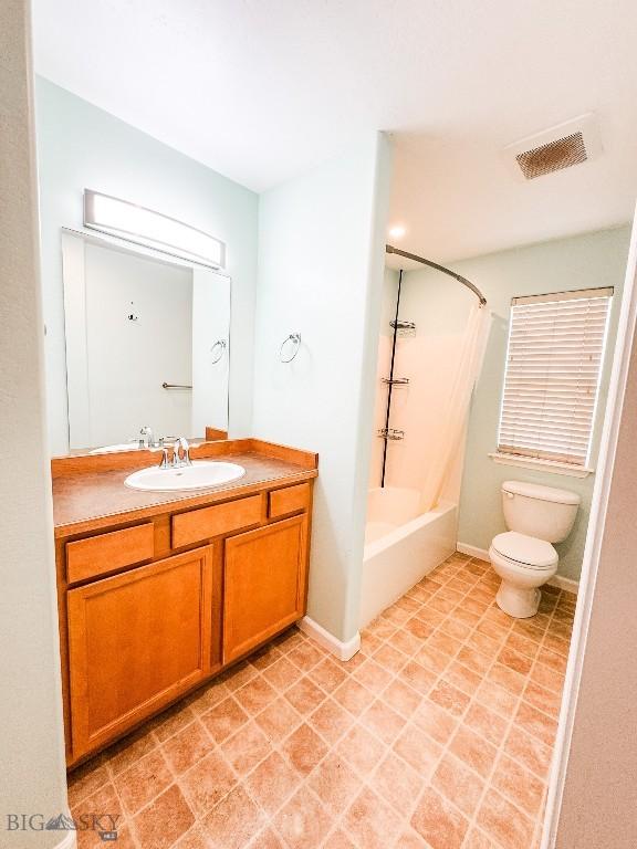 full bathroom with vanity, toilet, and shower / bath combination